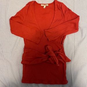 Red top with tie on belly area